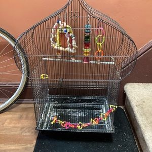 Chateau shaped bird cage in black with 5 toys